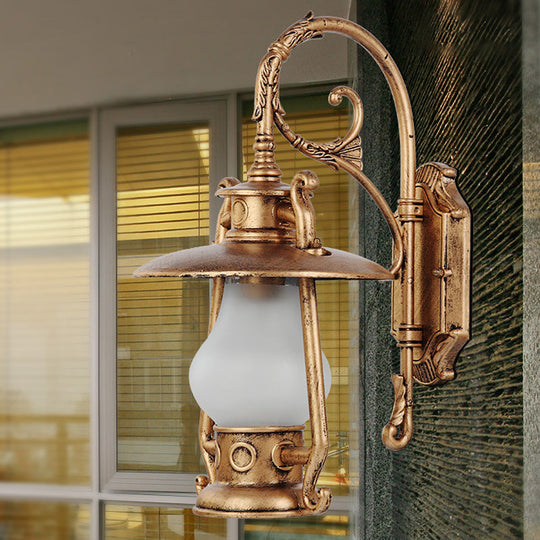 Frosted Glass Coastal Wall Mounted Lantern: Single Bulb Outdoor Sconce Light in Black/Aged Brass