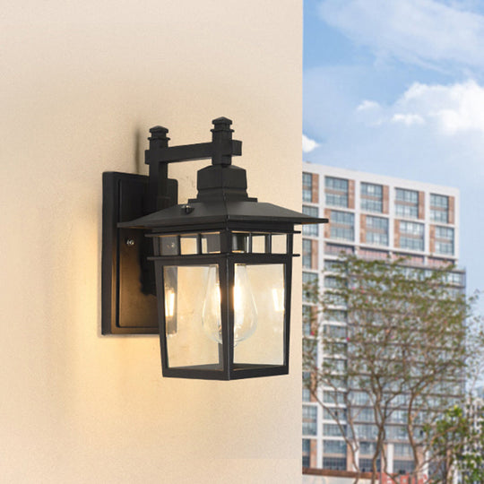 Industrial Outdoor Wall Lamp: Pavilion Clear Glass Wall Mounted Light in Black - 1-Bulb
