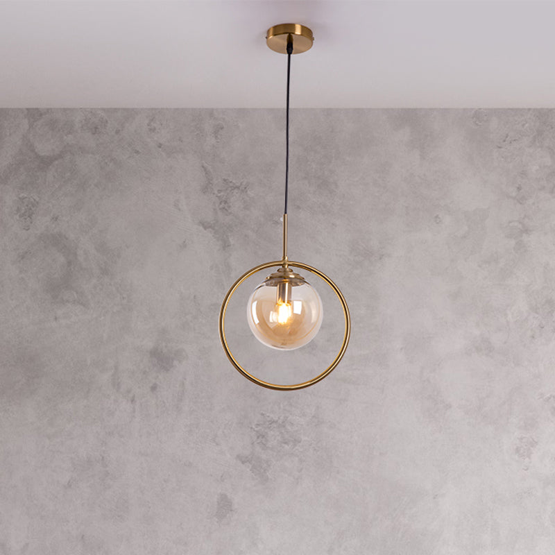 Postmodern Glass Pendant Light with Brass Ring for Bedroom - Single-Bulb Globe Down Lighting in Clear, Amber, and Smoke Grey