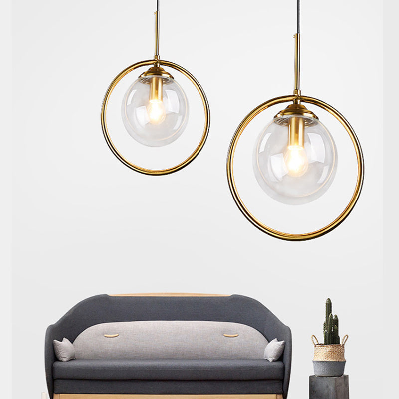 Postmodern Glass Pendant Light with Brass Ring for Bedroom - Single-Bulb Globe Down Lighting in Clear, Amber, and Smoke Grey