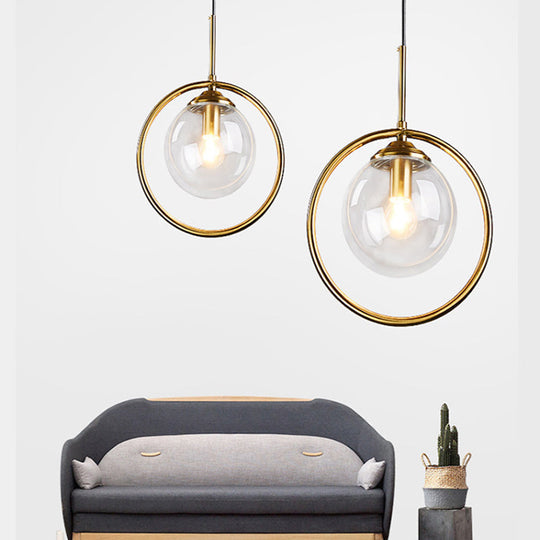 Postmodern Glass Pendant Light with Brass Ring for Bedroom - Single-Bulb Globe Down Lighting in Clear, Amber, and Smoke Grey