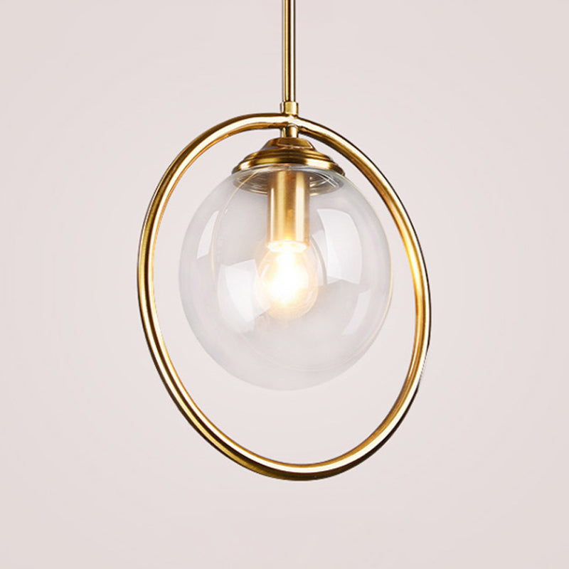 Postmodern Glass Pendant Light with Brass Ring for Bedroom - Single-Bulb Globe Down Lighting in Clear, Amber, and Smoke Grey