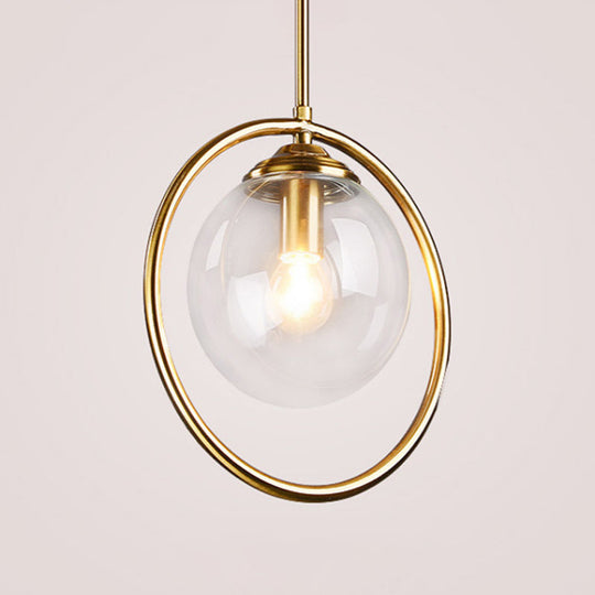 Postmodern Glass Pendant Light with Brass Ring for Bedroom - Single-Bulb Globe Down Lighting in Clear, Amber, and Smoke Grey