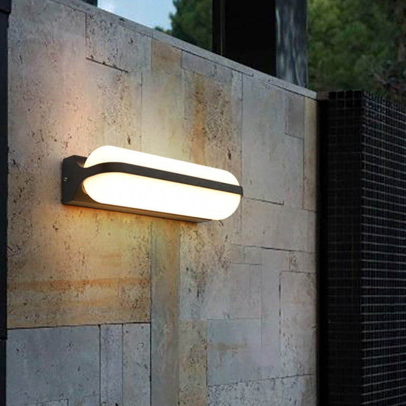 Modern Black Acrylic Wall Sconce with Flush Capsule Design and Half-Bulb Mounting