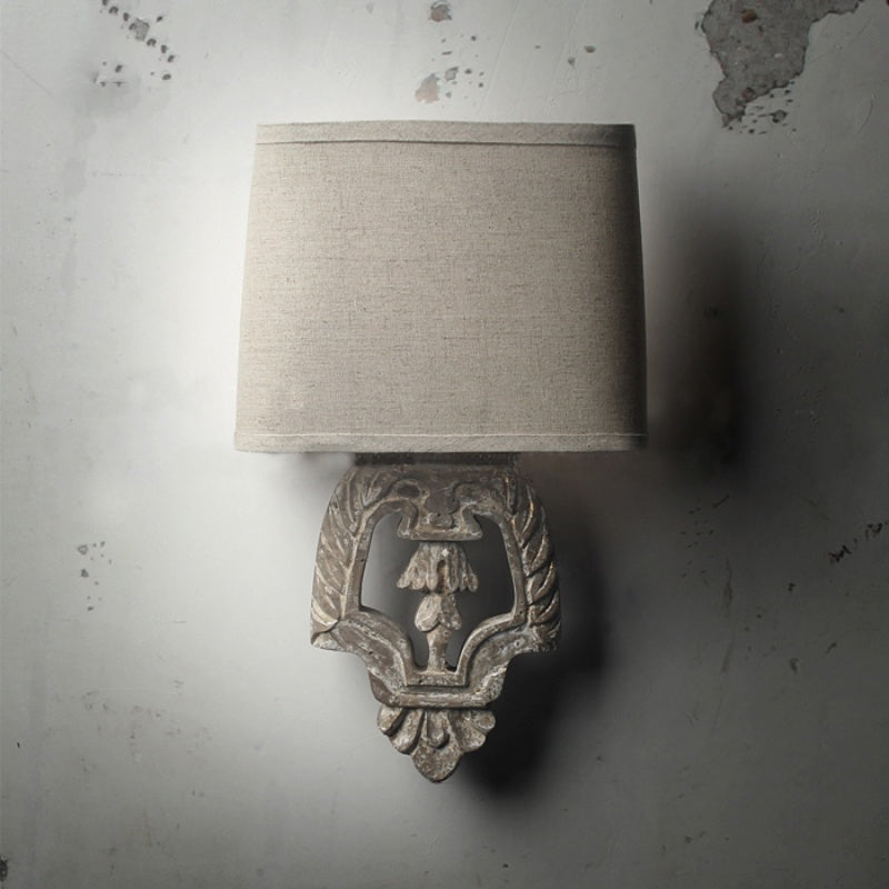 Country Style 1-Light Fabric Wall Sconce with Carved Backplate - Brown Finish