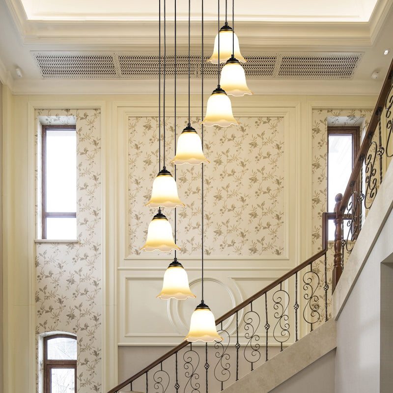 Minimalist Black Flower Stairs Pendant Light with Frosted Glass and Round Canopy