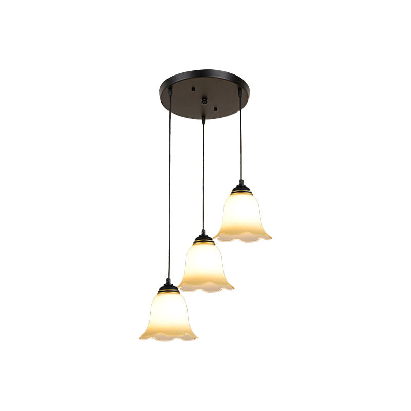 Minimalist Black Flower Stairs Pendant Light with Frosted Glass and Round Canopy