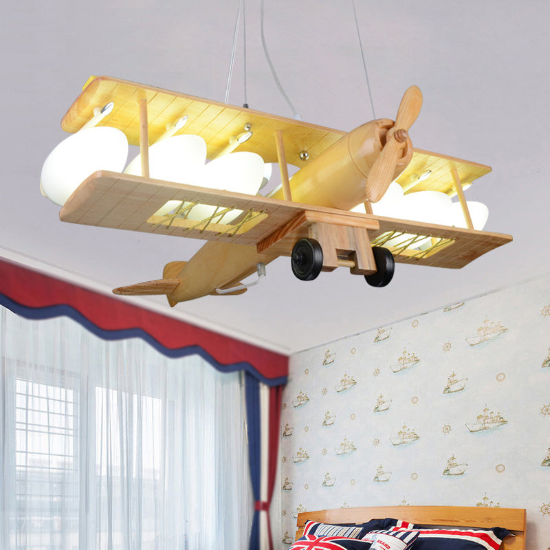 Nordic Beige Wood Pendant Light: Glider Shaped Hanging Light for Kindergarten