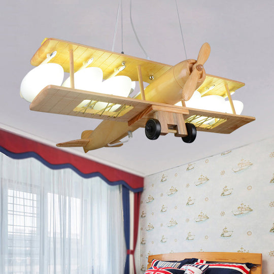 Nordic Beige Wood Pendant Light: Glider Shaped Hanging Light for Kindergarten