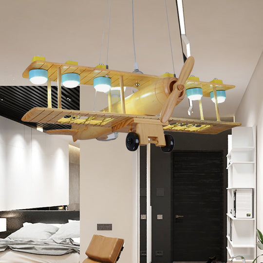 Nordic Beige Wood Pendant Light: Glider Shaped Hanging Light for Kindergarten