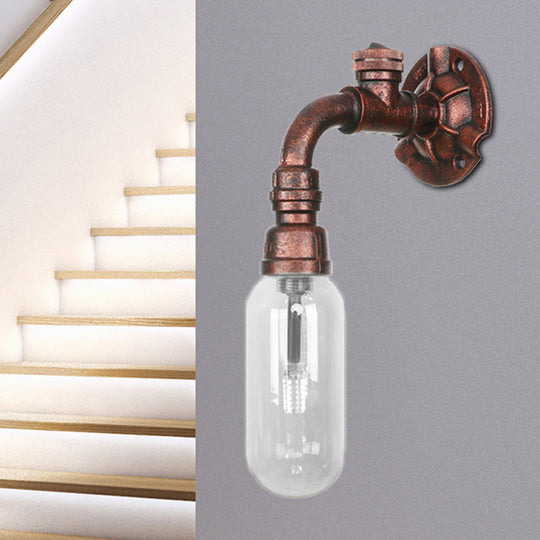 Industrial Pipe Wall Sconce: Clear Glass & Weathered Copper Finish, 1-Light Capsule Lighting