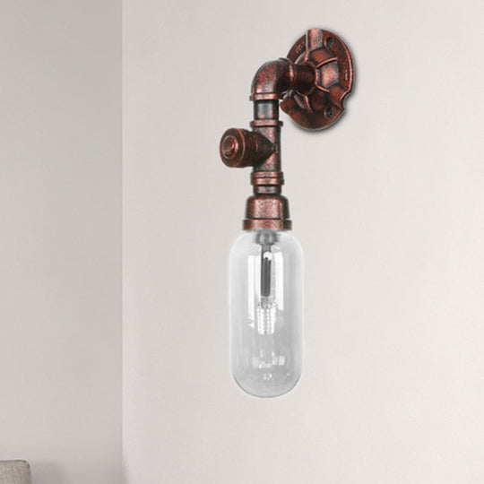 Industrial Pipe Wall Sconce: Clear Glass & Weathered Copper Finish, 1-Light Capsule Lighting