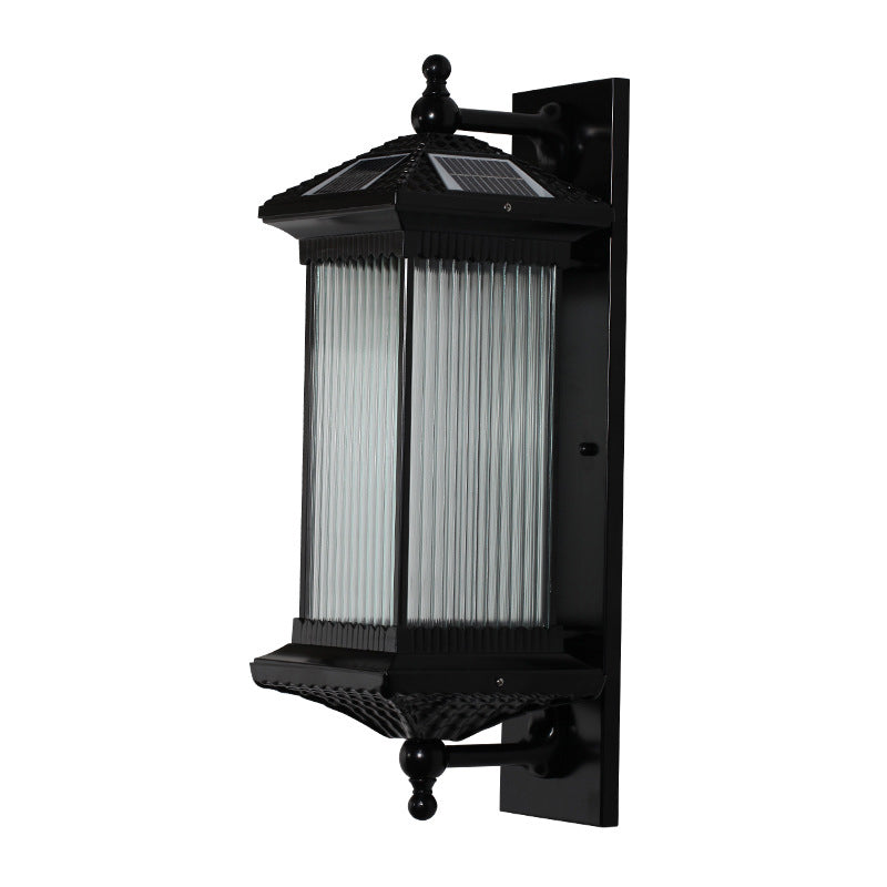 Traditional Glass LED Outdoor Wall Light with Solar Power and Ribbed Design.