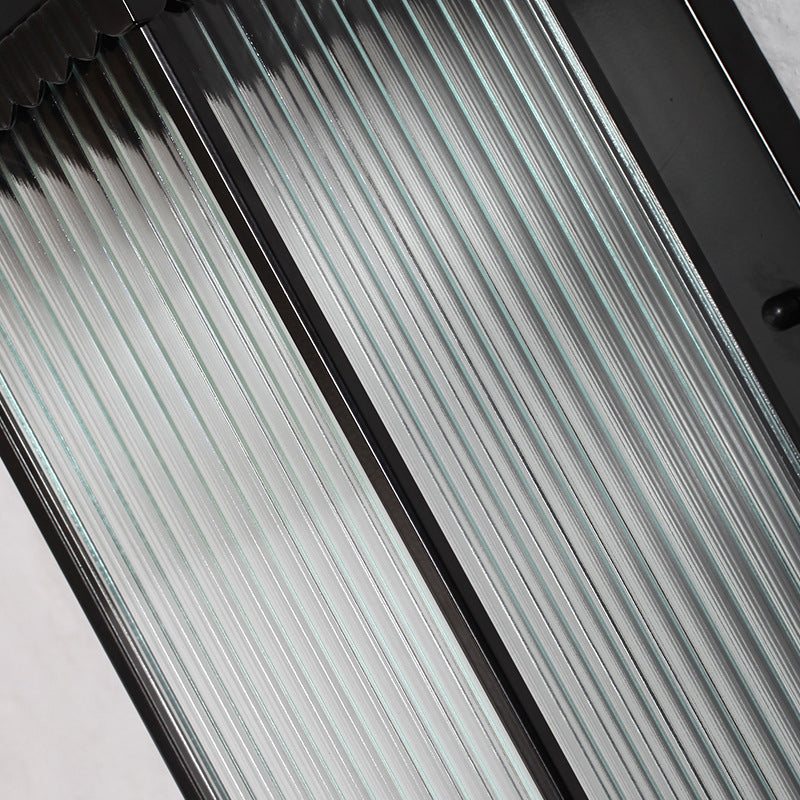 Traditional Glass LED Outdoor Wall Light with Solar Power and Ribbed Design.