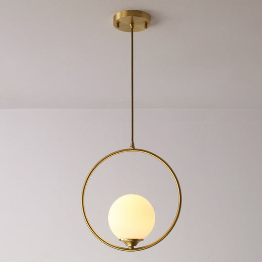Minimalist Antique Gold Ball Ceiling Lamp with Cream Glass Shade and Ring Decoration