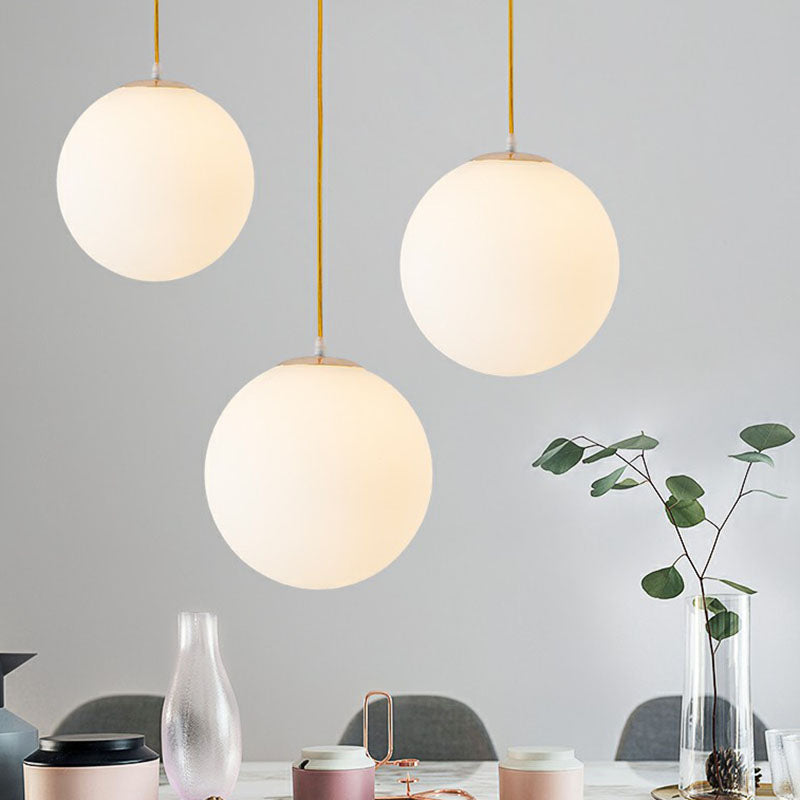 Sleek White Glass Pendant Light for Minimalist Table Settings