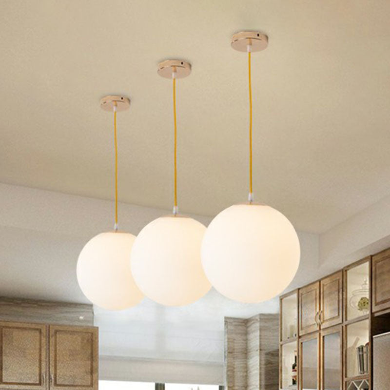 Sleek White Glass Pendant Light for Minimalist Table Settings