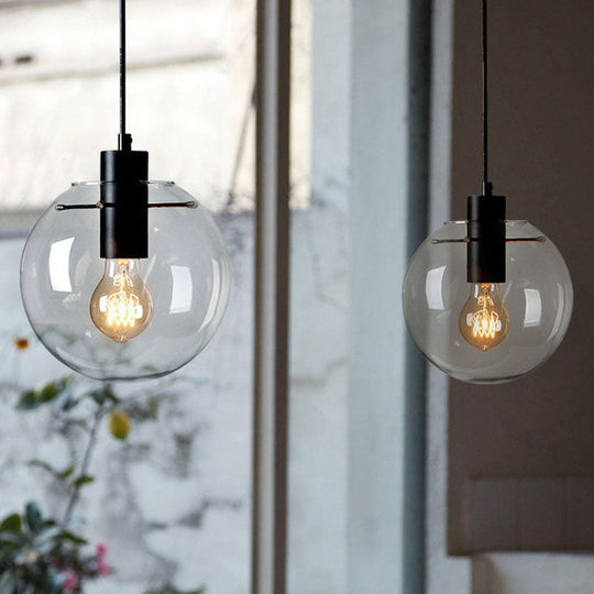 Minimalistic 1-Light Black Pendant Light Fixture - Clear Glass Globe Design for Restaurants