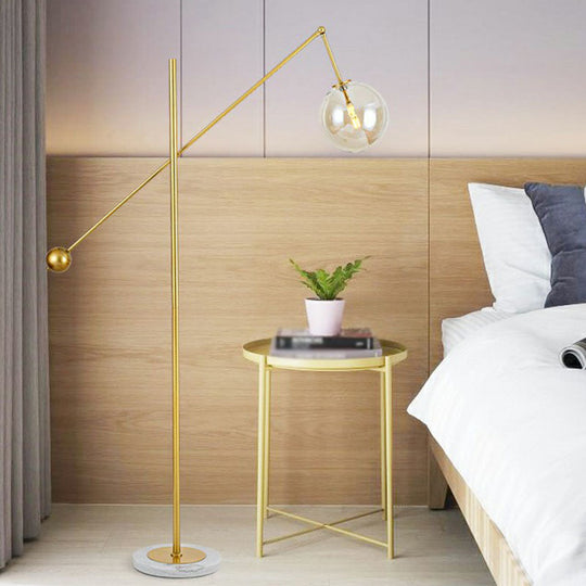 Postmodern Brass Plated Balance Arm Floor Lamp with Glass Spherical Shade - Stylish Metal Stand-Up Light, 1-Light