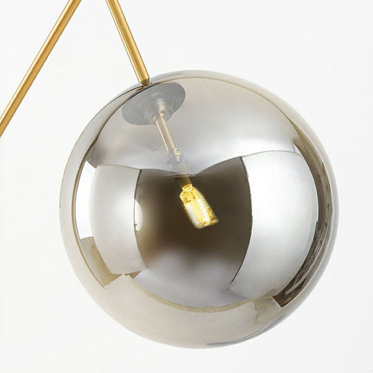 Postmodern Brass Plated Balance Arm Floor Lamp with Glass Spherical Shade - Stylish Metal Stand-Up Light, 1-Light