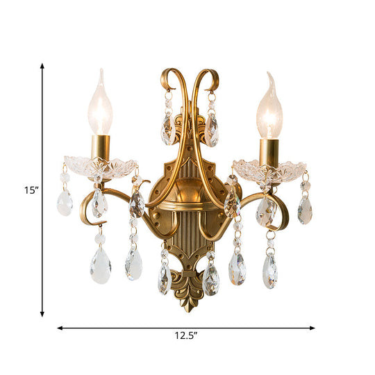 Traditional Crystal Candle Wall Sconce with Antiqued Brass Finish and Scroll Arm