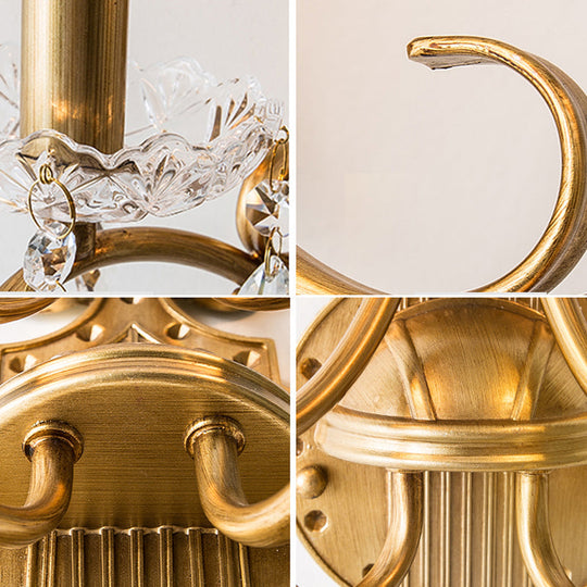 Traditional Crystal Candle Wall Sconce with Antiqued Brass Finish and Scroll Arm