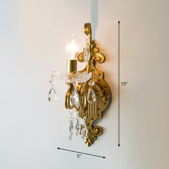 Traditional Crystal Candle Wall Sconce with Antiqued Brass Finish and Scroll Arm