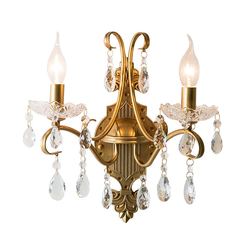 Traditional Crystal Candle Wall Sconce with Antiqued Brass Finish and Scroll Arm