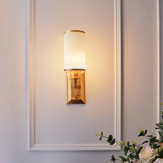 1-Light White Glass Wall Sconce in Traditional Brass - Elegant Cylindrical Dining Room Light