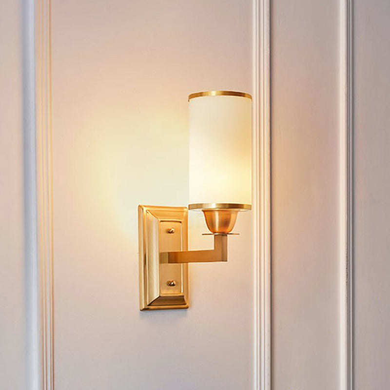 1-Light White Glass Wall Sconce in Traditional Brass - Elegant Cylindrical Dining Room Light