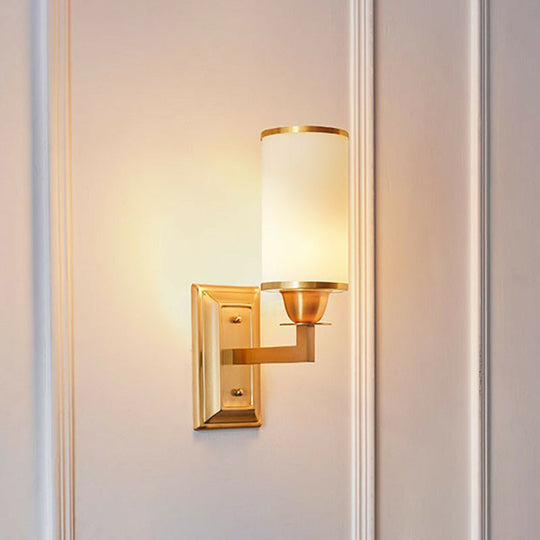 1-Light White Glass Wall Sconce in Traditional Brass - Elegant Cylindrical Dining Room Light