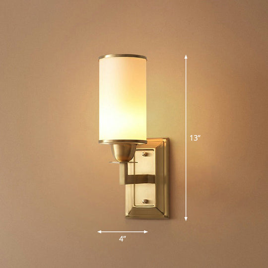1-Light White Glass Wall Sconce in Traditional Brass - Elegant Cylindrical Dining Room Light