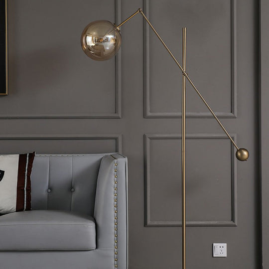 Simplicity 1-Light Bronze Amber Glass Sphere Floor Lamp with Balance Arm