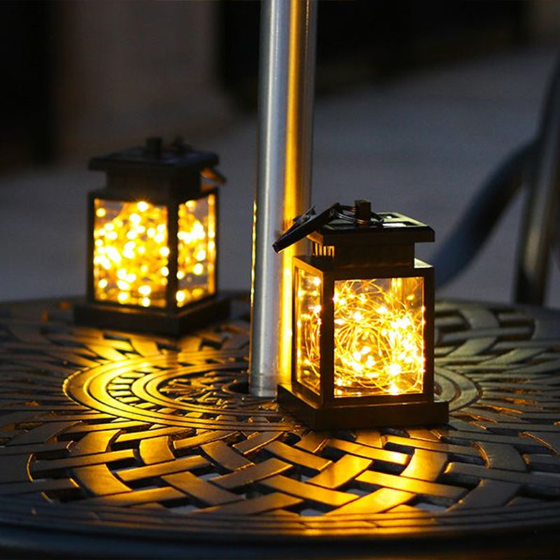 Artistic Black LED Solar Lantern Pendant Light with Clear Glass, Clamp, and Hook