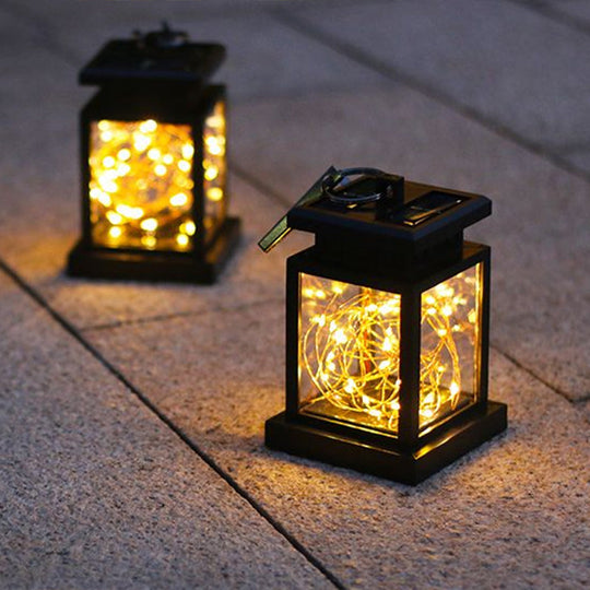 Artistic Black LED Solar Lantern Pendant Light with Clear Glass, Clamp, and Hook