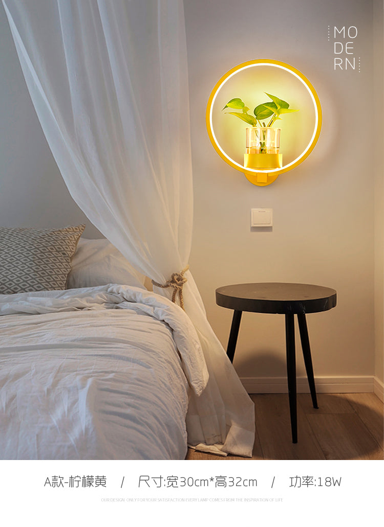 Modern Metal Wall Sconce with Artistic Loop Design and Clear Glass Plant Pot