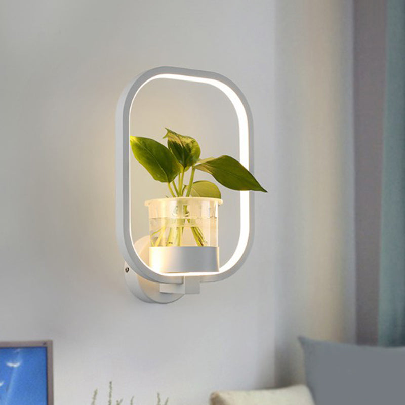 Modern Metal Wall Sconce with Artistic Loop Design and Clear Glass Plant Pot