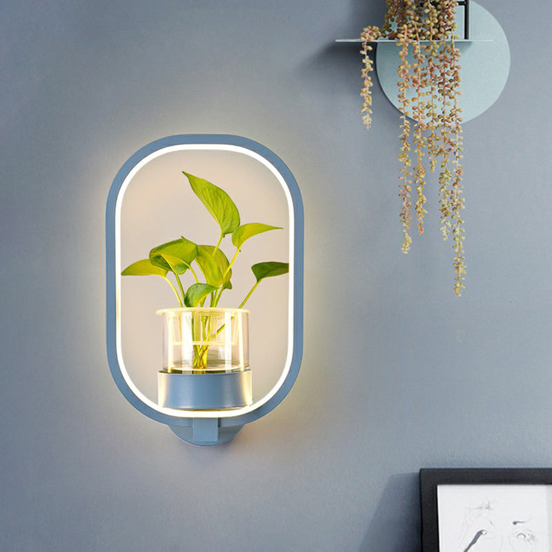Modern Metal Wall Sconce with Artistic Loop Design and Clear Glass Plant Pot