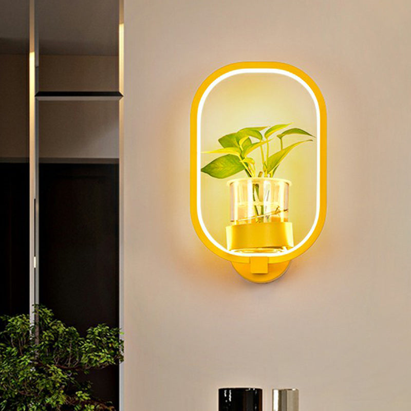 Modern Metal Wall Sconce with Artistic Loop Design and Clear Glass Plant Pot