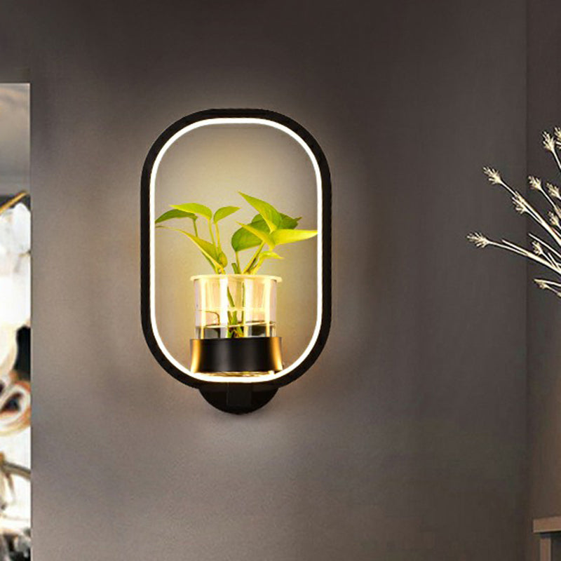 Modern Metal Wall Sconce with Artistic Loop Design and Clear Glass Plant Pot