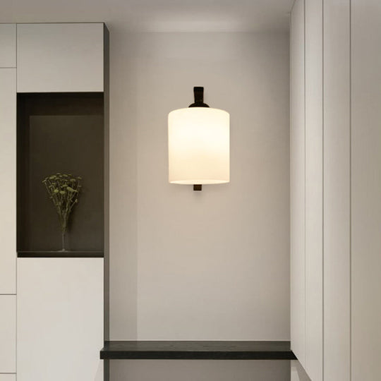 Vintage Cylindrical White Glass Wall Sconce with Curved Black Arm