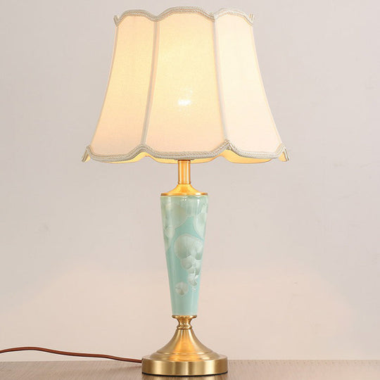 Blue Fabric Table Lamp with Scalloped Shade for a Classic Nighttime Glow