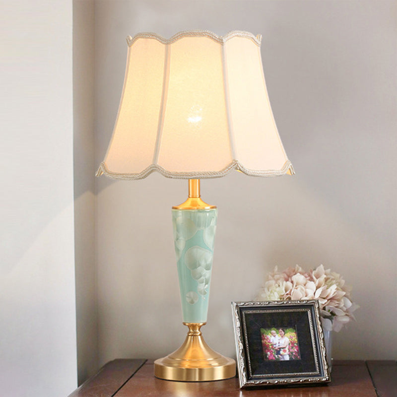 Blue Fabric Table Lamp with Scalloped Shade for a Classic Nighttime Glow