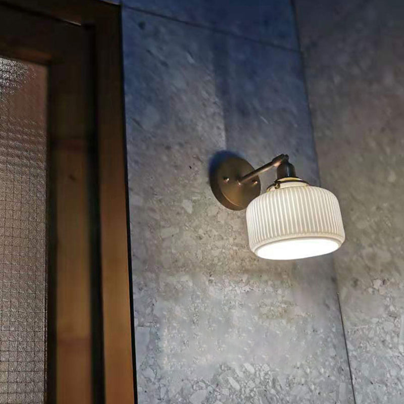 Brass Pivot Joint Foyer Sconce: Round Ribbed Glass Wall Light with White Simplicity (1 Bulb)