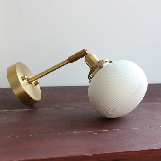 Brass Pivot Joint Foyer Sconce: Round Ribbed Glass Wall Light with White Simplicity (1 Bulb)