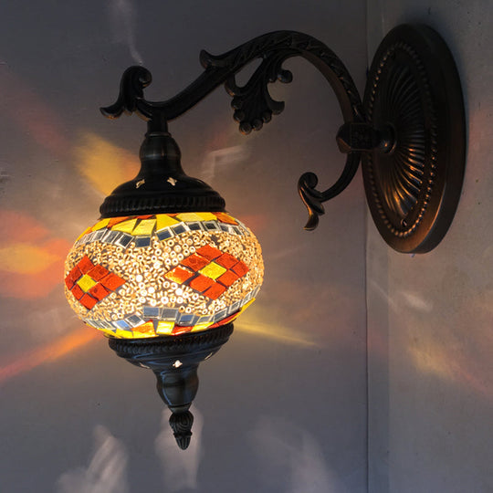 Curved Arm Sconce Light: Traditional Metal 1-Head Bronze Wall Lamp with Ball Yellow/Green Glass Shade for Balcony