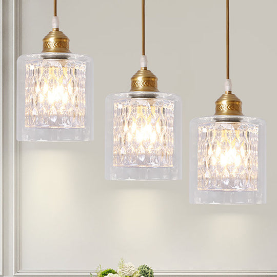 Modern Brass Cylinder Pendant Light with Prismatic Glass Shade - 3 Lights, Linear/Round Canopy