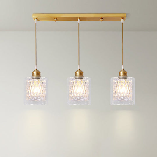 Modern Brass Cylinder Pendant Light with Prismatic Glass Shade - 3 Lights, Linear/Round Canopy