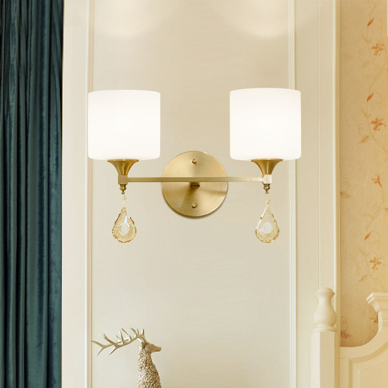 Modern Milk Glass Wall Sconce with Brass Finish and Amber Crystal Draping