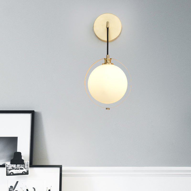 Modern White Glass Ball Sconce Light with Brass Wall Mount and Curved Arm - 1 Bulb